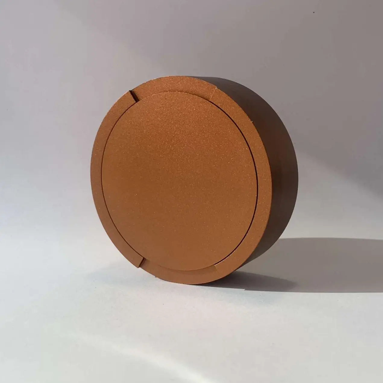 Original Pouchy in bronze — custom laser-engraved metal snus pot, original build