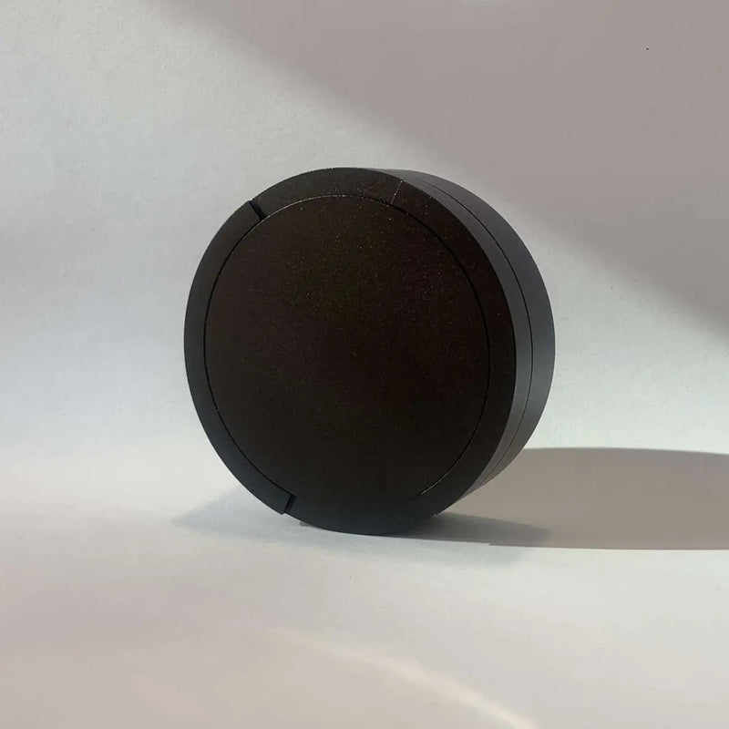 Original Pouchy in black — custom laser-engraved metal snus pot, classic size