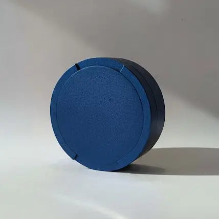 Original Pouchy in navy blue — laser-engraved metal snus pot for nicotine pouches
